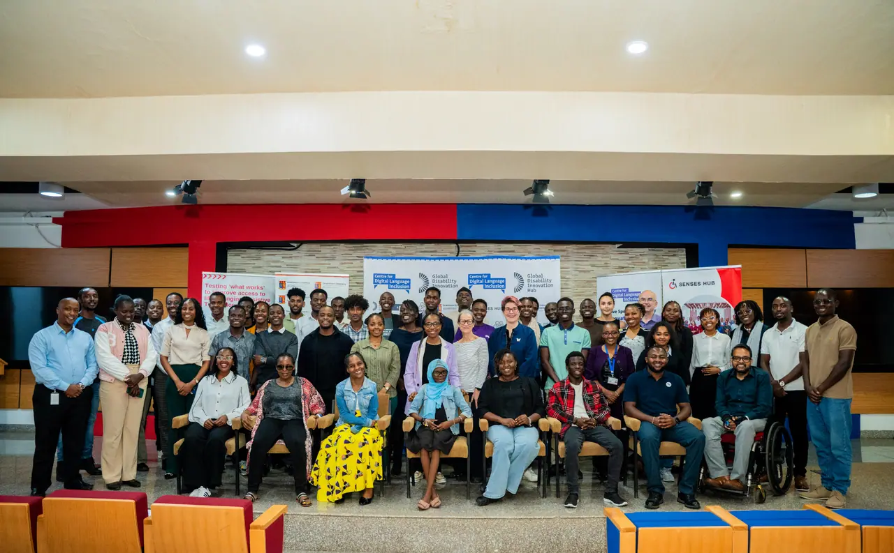 A large group at a speech technology session in Nairobi, including wheelchair users